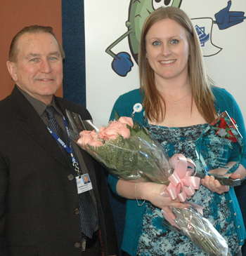 A picture of Ilia Murray receiving the 2011 Quality Champion award with Norman Kasian, President and CEO or Riverview Health Centre